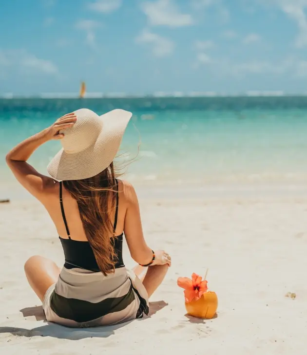 Woman enjoying a sunny day at the beach