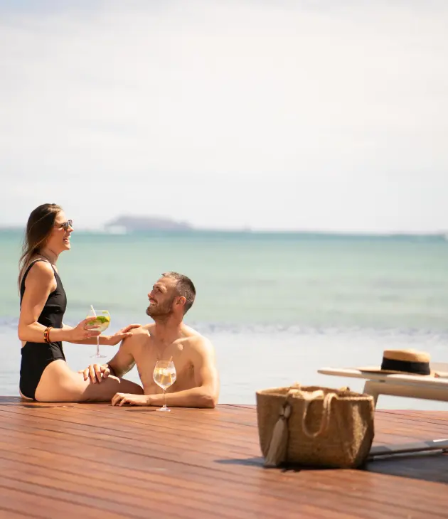 A relaxed couple enjoying the serene atmosphere near the beach of Veranda Paul et Virginie