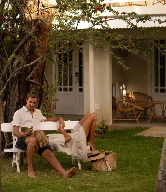 Relaxed couple sitting on a bench, enjoying a peaceful outdoor moment